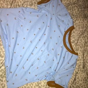 It’s a blue T-shirt, that can be worn as a mid-crop top or A shirt